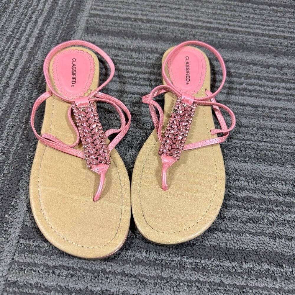 Classified pink flat rhinestone embellished thong ankle strap sandals.